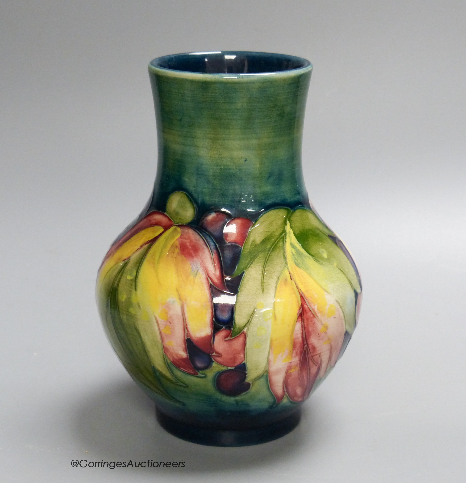 A Moorcroft leaf and berry pattern vase, 17cm high